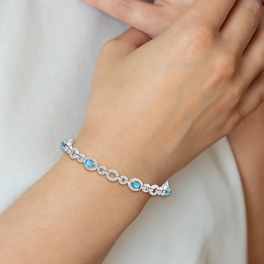 Sterling Silver Rhodium-plated Dia. & Lt Swiss Blue Topaz Oval Bracelet 7 inches
