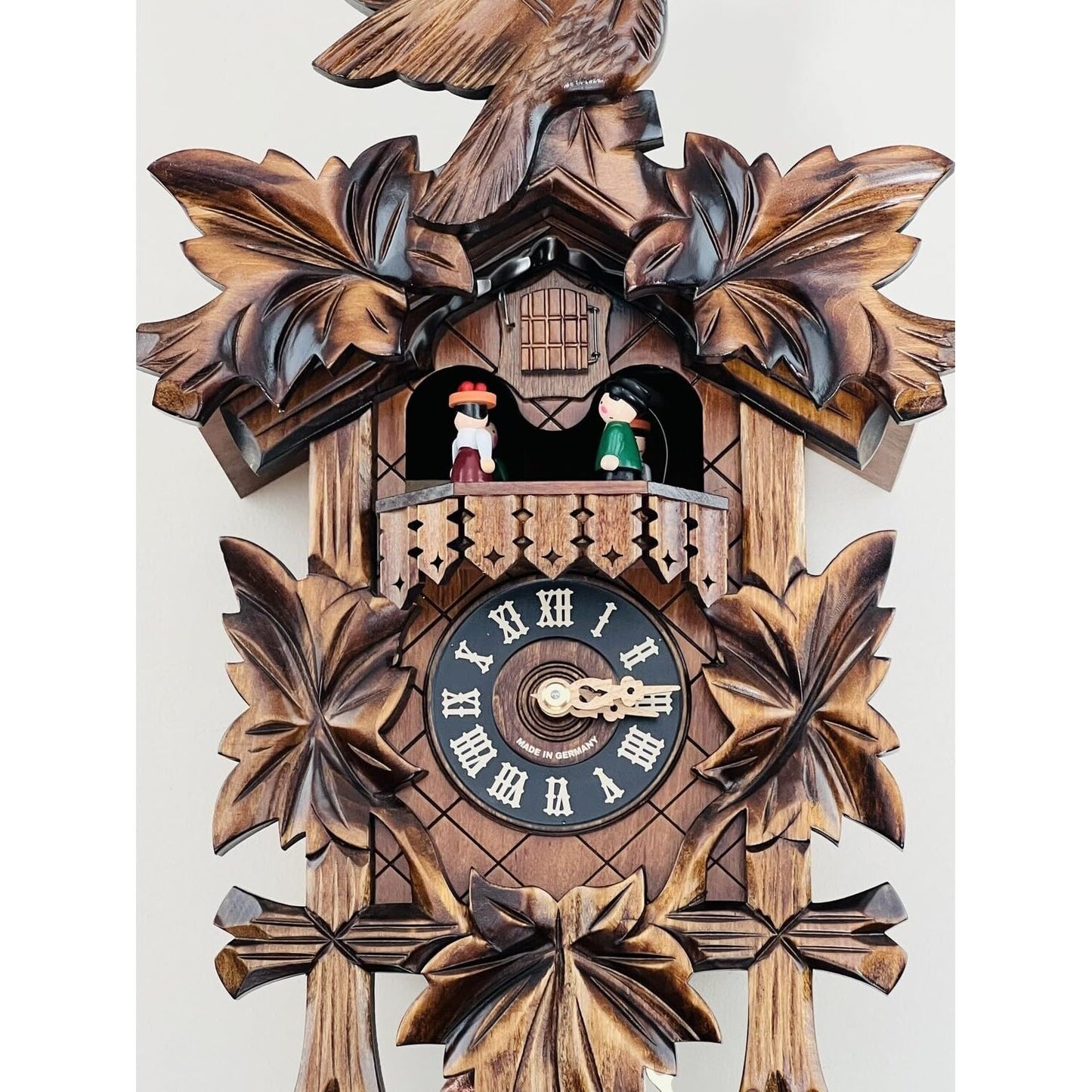 River City Clocks One Day Musical Cuckoo Clock with Dancers, Five Hand-carved Maple Leaves, and One Bird - 14 Inches Tall - Model # MD411-14