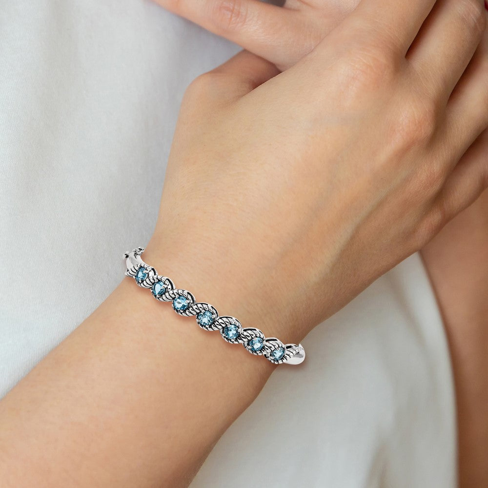 Sterling Silver Rhodium-plated Light Swiss Blue Topaz Hinged Bangle 7.25 inches