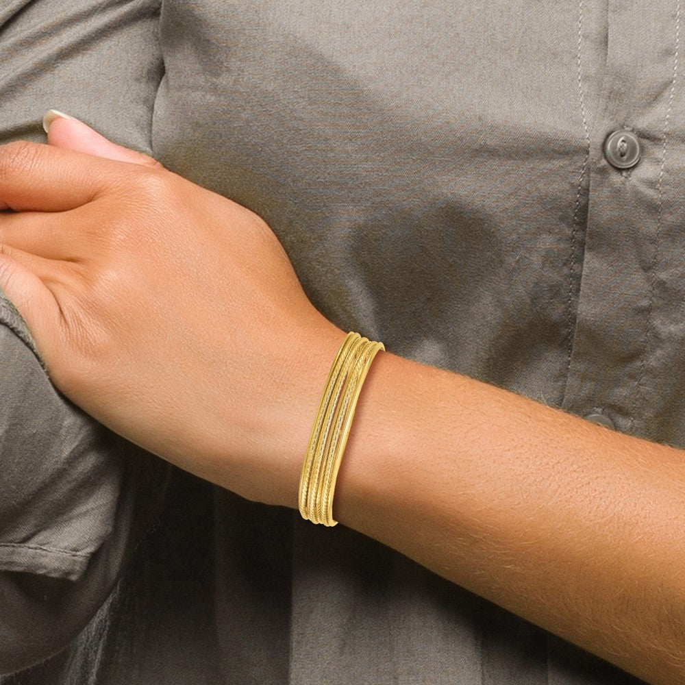 14K Polished and Twisted 7-Layer Slip-on Bangle