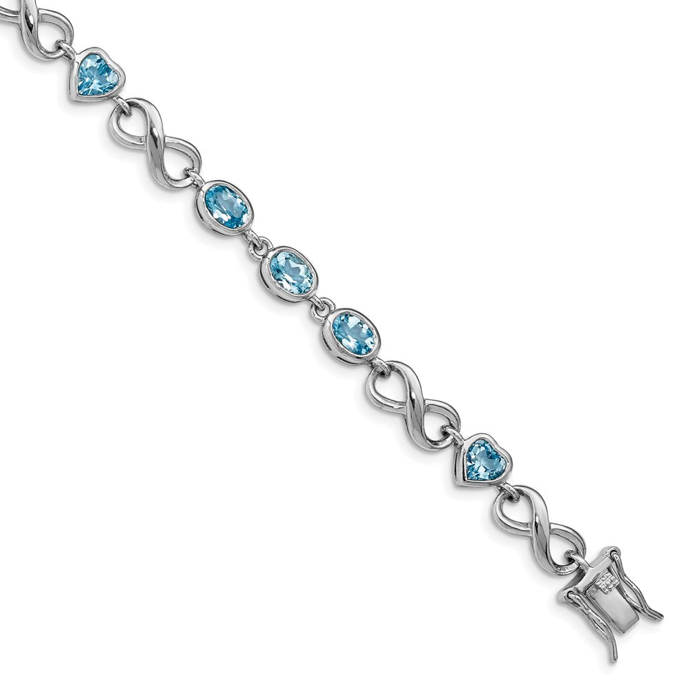 Sterling Silver Rhodium-plated Oval Heart Blue Topaz Bracelet 7 inches