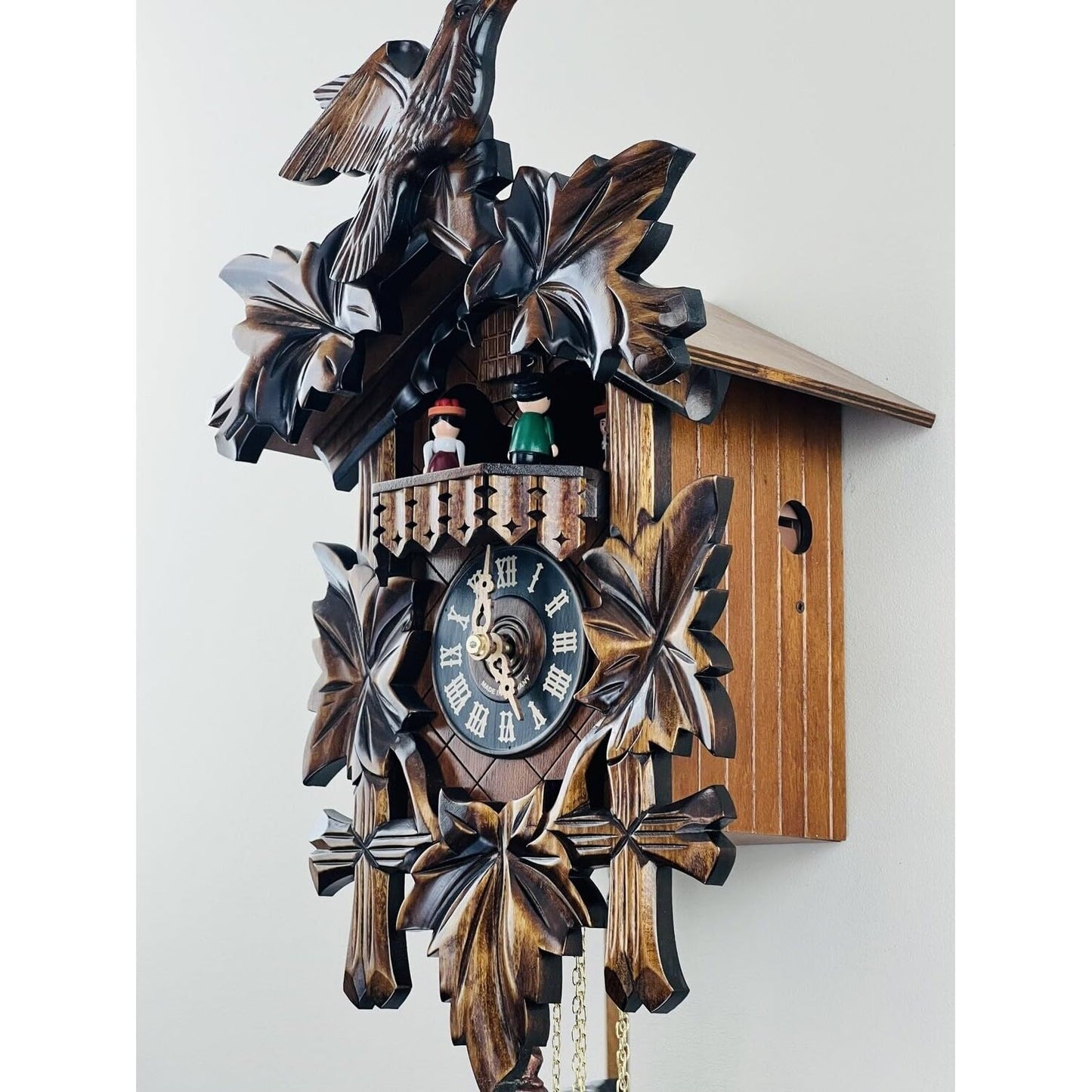 River City Clocks One Day Musical Cuckoo Clock with Dancers, Five Hand-carved Maple Leaves, and One Bird - 14 Inches Tall - Model # MD411-14