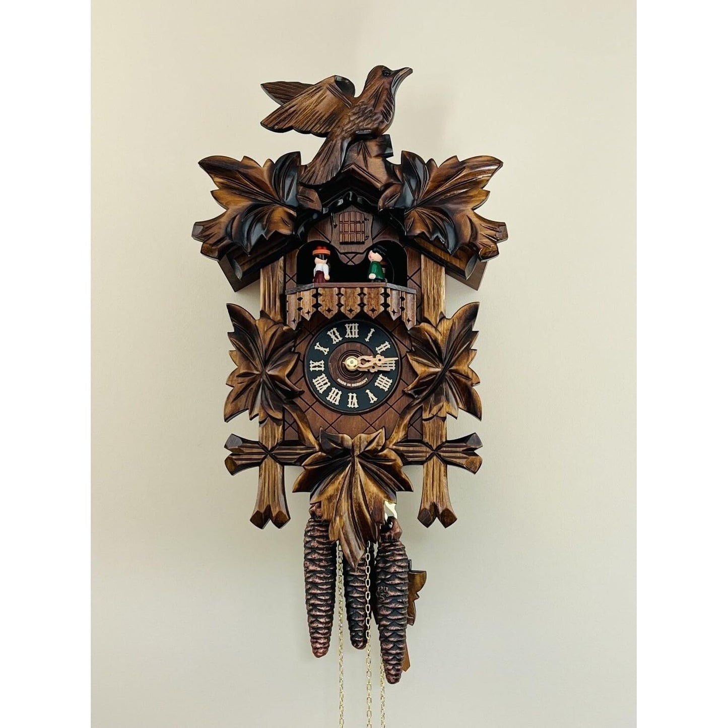 River City Clocks One Day Musical Cuckoo Clock with Dancers, Five Hand-carved Maple Leaves, and One Bird - 14 Inches Tall - Model # MD411-14